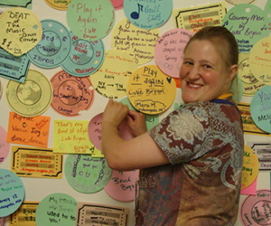 Woman in front of pin board