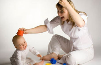 Mom laughing with her baby