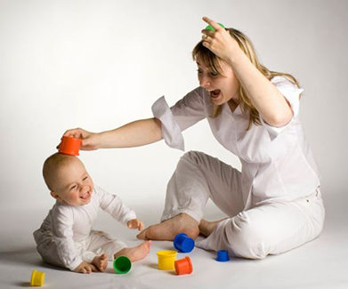 Mom laughing with her baby